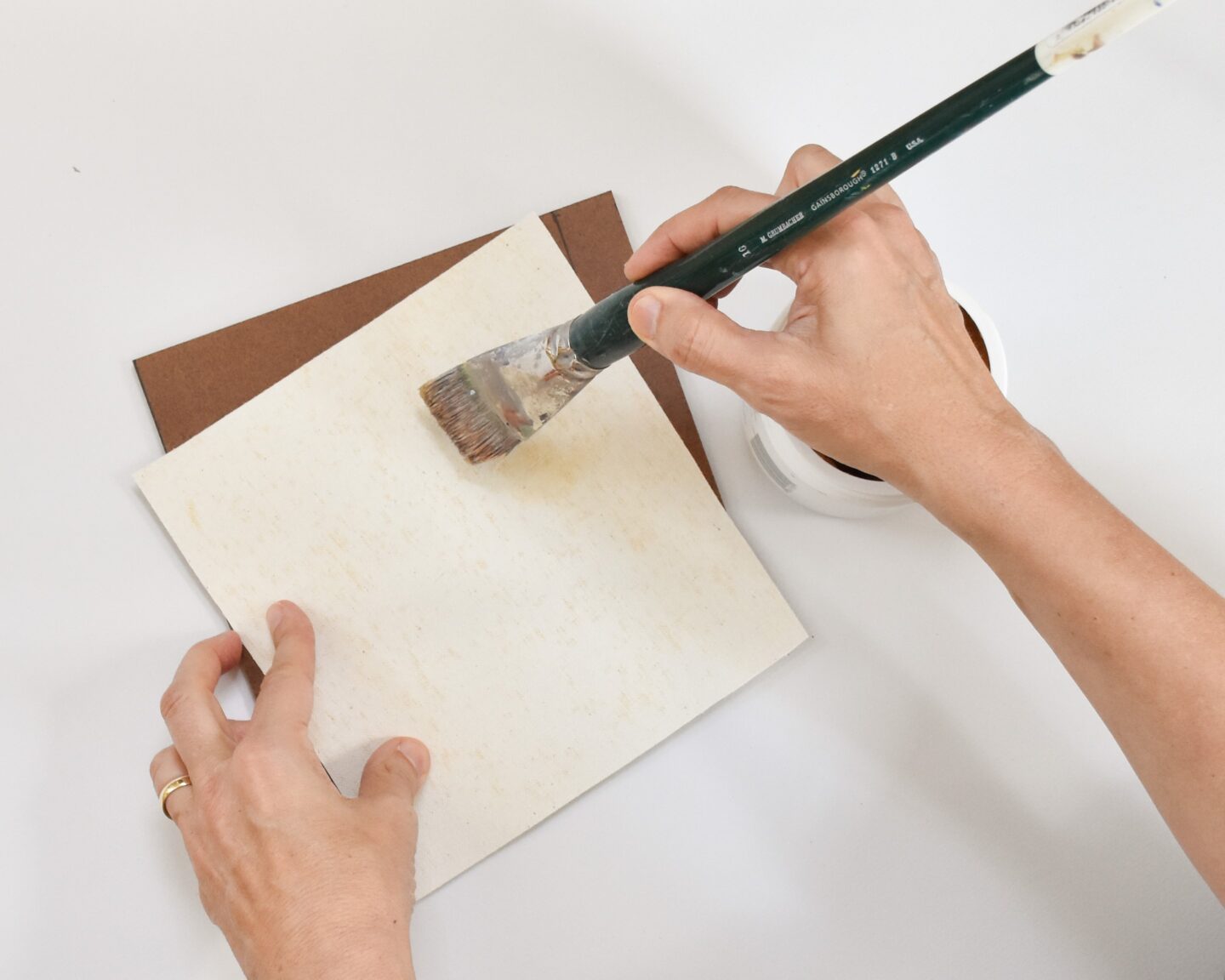 glueing canvas to a masonite support